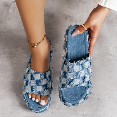 Upgrade your style with our Denim Plaid Faux Leather Platform Sandals. Crafted with a unique combination of denim plaid and faux leather, these sandals offer a trendy and chic look