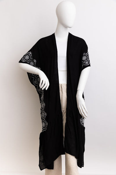 This longline kimono boasts exquisite tribal embroidery, creating a stunning boho look. Its ankle length adds elegance and versatility to any outfit.