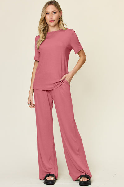 Expertly crafted, this set combines a classic round neck short sleeve t-shirt with stylish wide leg pants