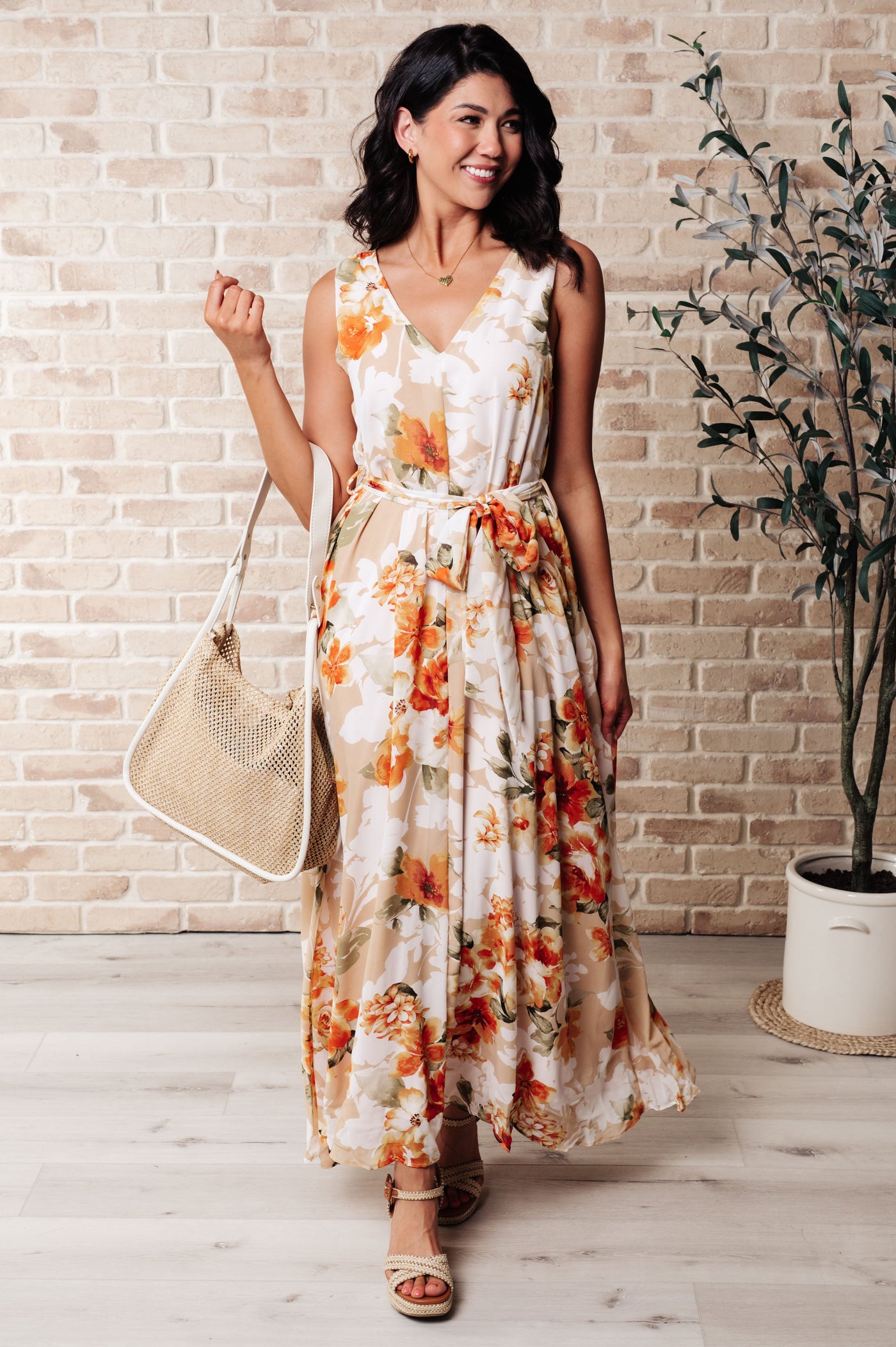 Feel the warmth in our It's All Sunshine V-Neck Floral Dress! This beautiful dress features a flattering V-neckline and a functional waist tie to accentuate your figure