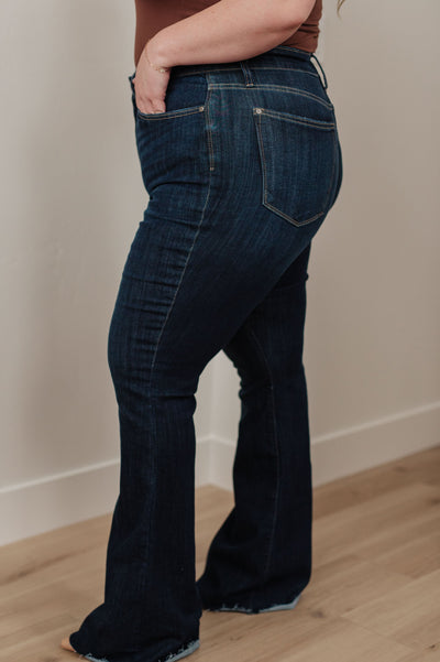 Our Jane High Rise Raw Hem Flare Jeans from Judy Blue are the perfect piece for any wardrobe.