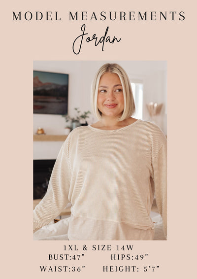 Featuring a delicate round neckline and playful flutter sleeves, this top is perfect for all occasions. Get ready to turn heads and feel confident with every wear!