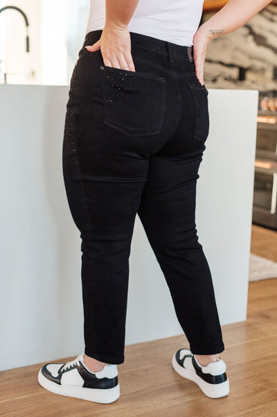 Their high-rise fit and stretchy denim ensure comfort while the rhinestones add sophisticated flair