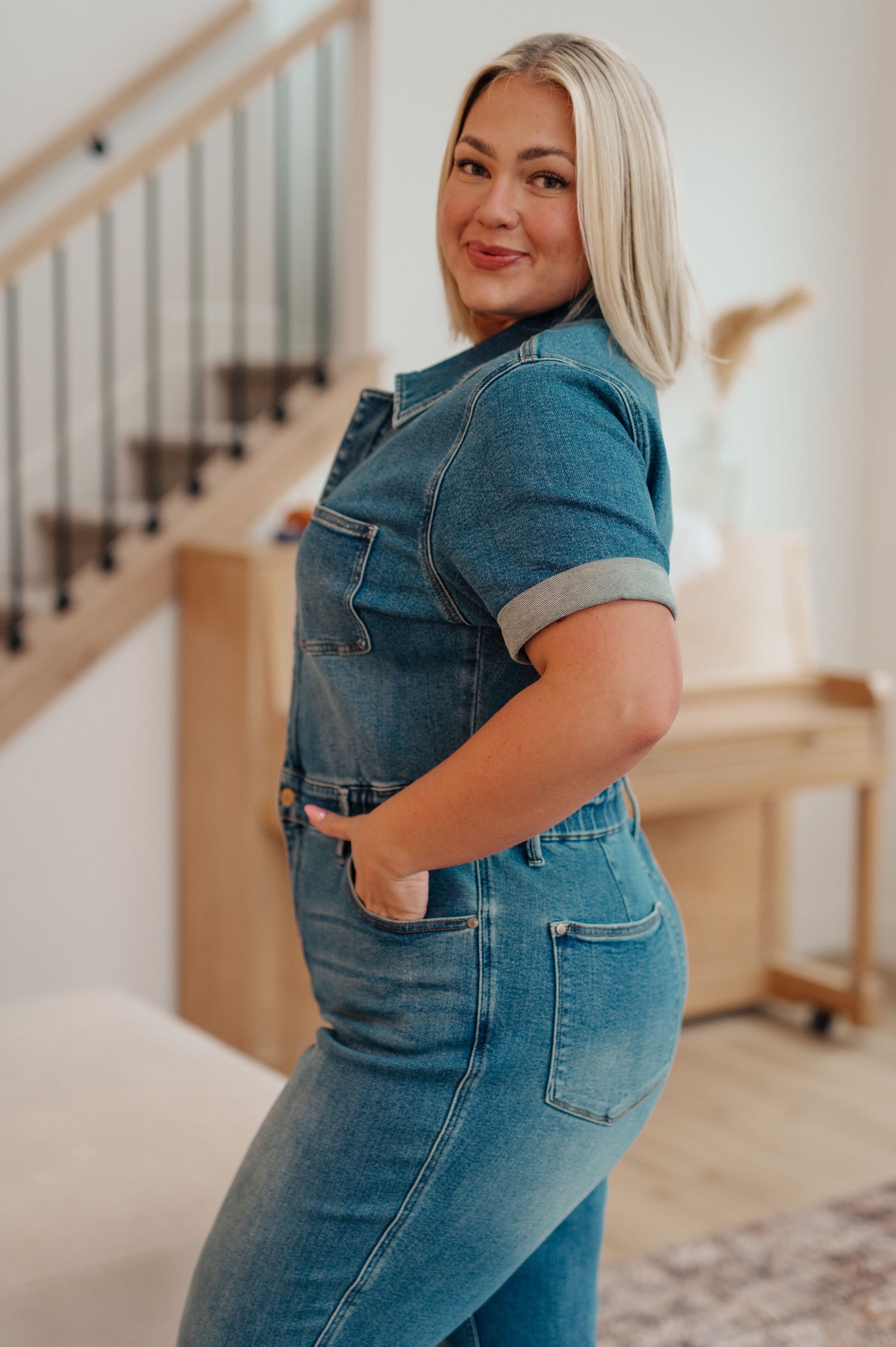 Sylvia Short Sleeve Denim Jumpsuit from Judy Blue is perfect for everyday wear and features a short-sleeve silhouette, zip closure, snap waistband, 4-way stretch