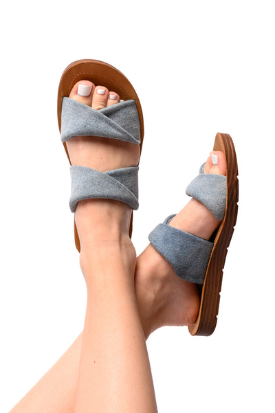 Experience comfort and style with our With a Twist Sandal! These open-toed sandals feature a unique twist design, providing an eye-catching detail to any outfit