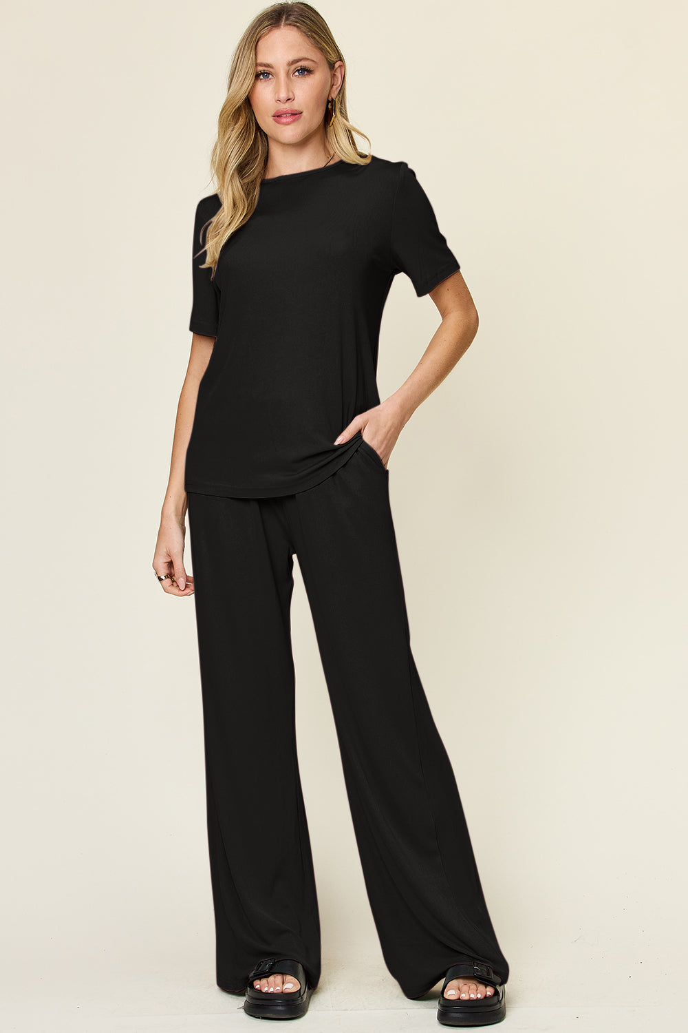 Expertly crafted, this set combines a classic round neck short sleeve t-shirt with stylish wide leg pants