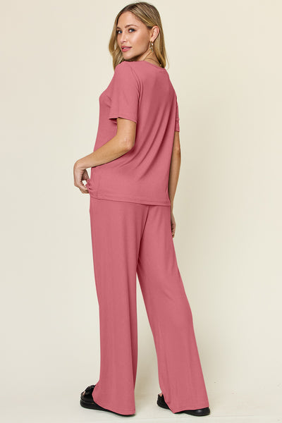 Expertly crafted, this set combines a classic round neck short sleeve t-shirt with stylish wide leg pants