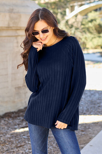 This Ribbed Round Neck Long Sleeve Knit Top is crafted with a comfortable and breathable ribbed knit fabric