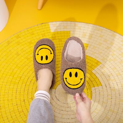 Introducing the adorable Smiley Face Cozy Slippers!These cozy and plush slippers are designed to bring a smile to your face every time you put them on. With their soft and warm material, you'll feel like you're walking on clouds