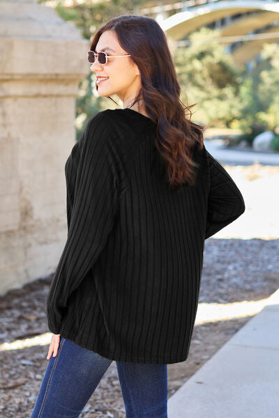 This Ribbed Round Neck Long Sleeve Knit Top is crafted with a comfortable and breathable ribbed knit fabric