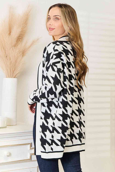 Crafted in a classic houndstooth pattern, this open-front longline cardigan exudes elegance and versatility