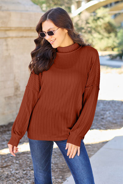 Our Ribbed Exposed Seam Mock Neck Knit Top is made from a lightweight and breathable material, giving you all-day comfort and style