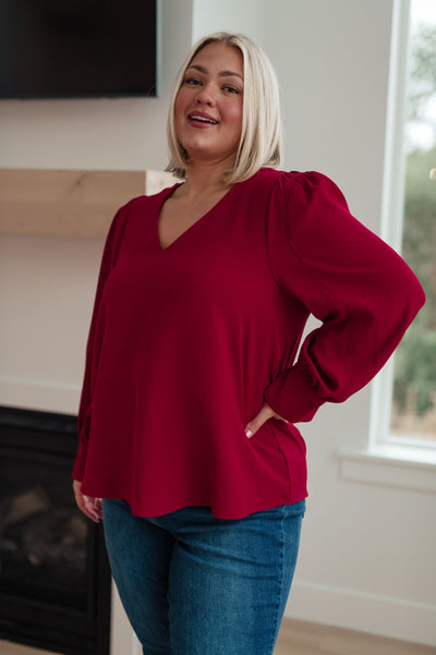 Look stylish and professional this season with our Back in Business V-Neck Blouse. This tailored blouse features a flattering v-neckline, puff sleeves and an easy-to-wear construction
