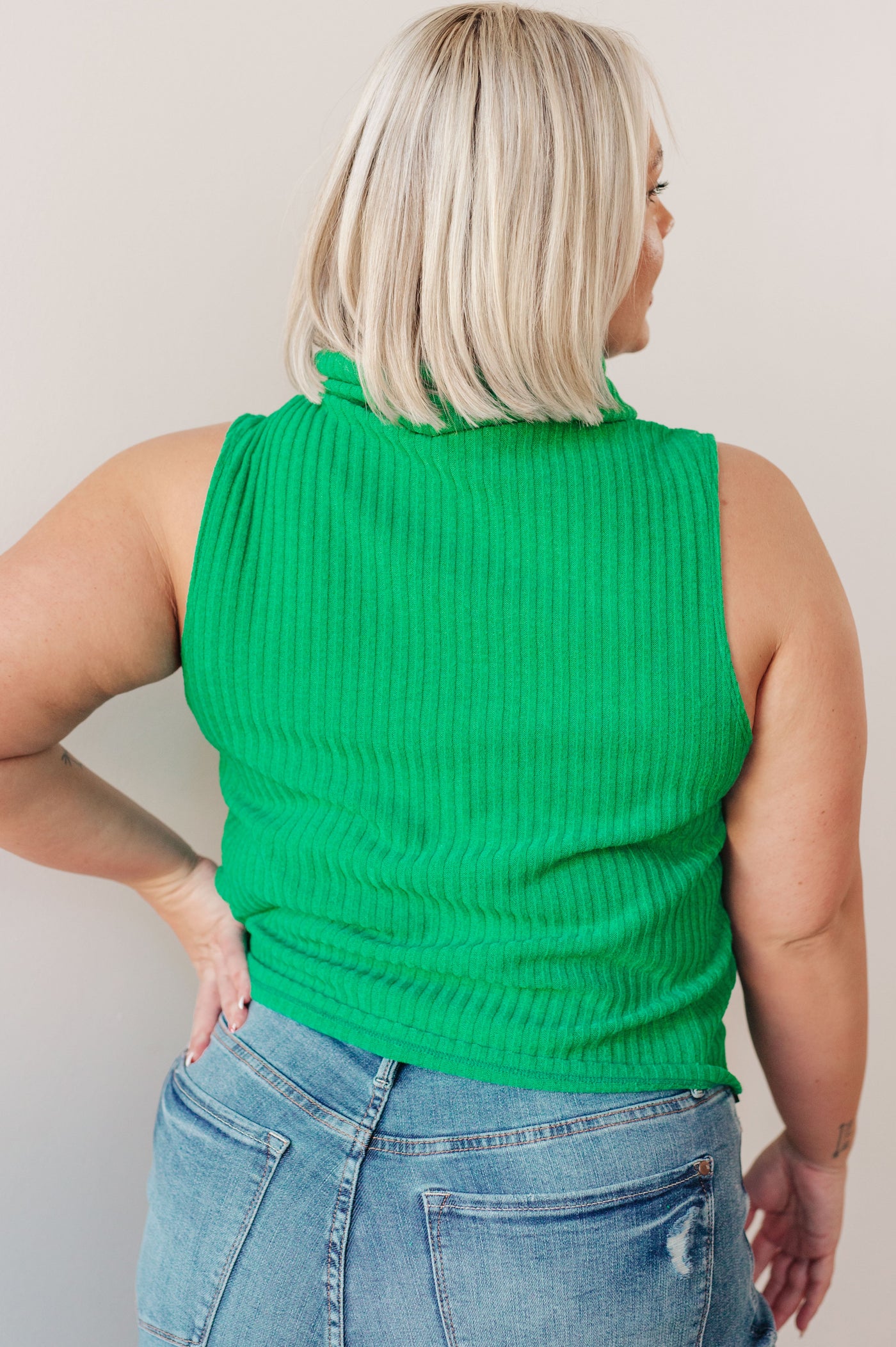 Experience warmth and style with our Before You Go Sleeveless Turtleneck Sweater. Made with a ribbed knit, this turtleneck sweater is perfect for layering and adding a touch of color to any outfit
