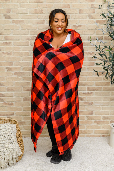 Spending our nights on the couch snuggled up with the Buffalo Plaid Blanket In Red & BlackThis cozy blanket features a red and black buffalo plaid design made from an ultra soft fleece.