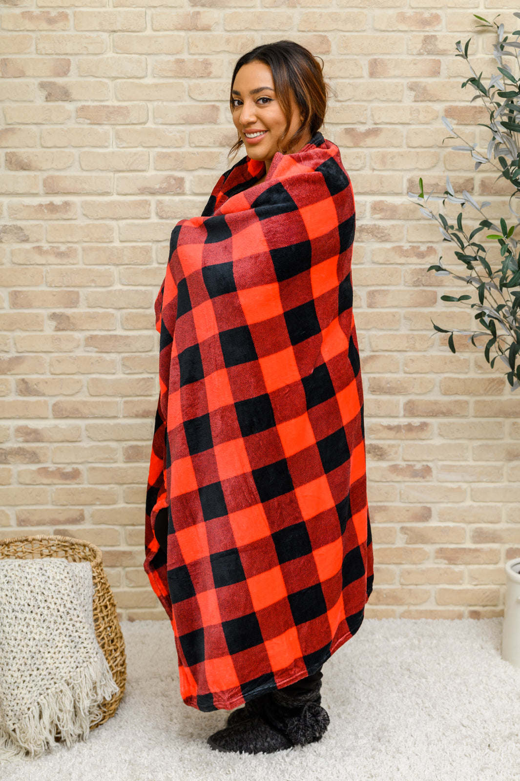 Spending our nights on the couch snuggled up with the Buffalo Plaid Blanket In Red & BlackThis cozy blanket features a red and black buffalo plaid design made from an ultra soft fleece.