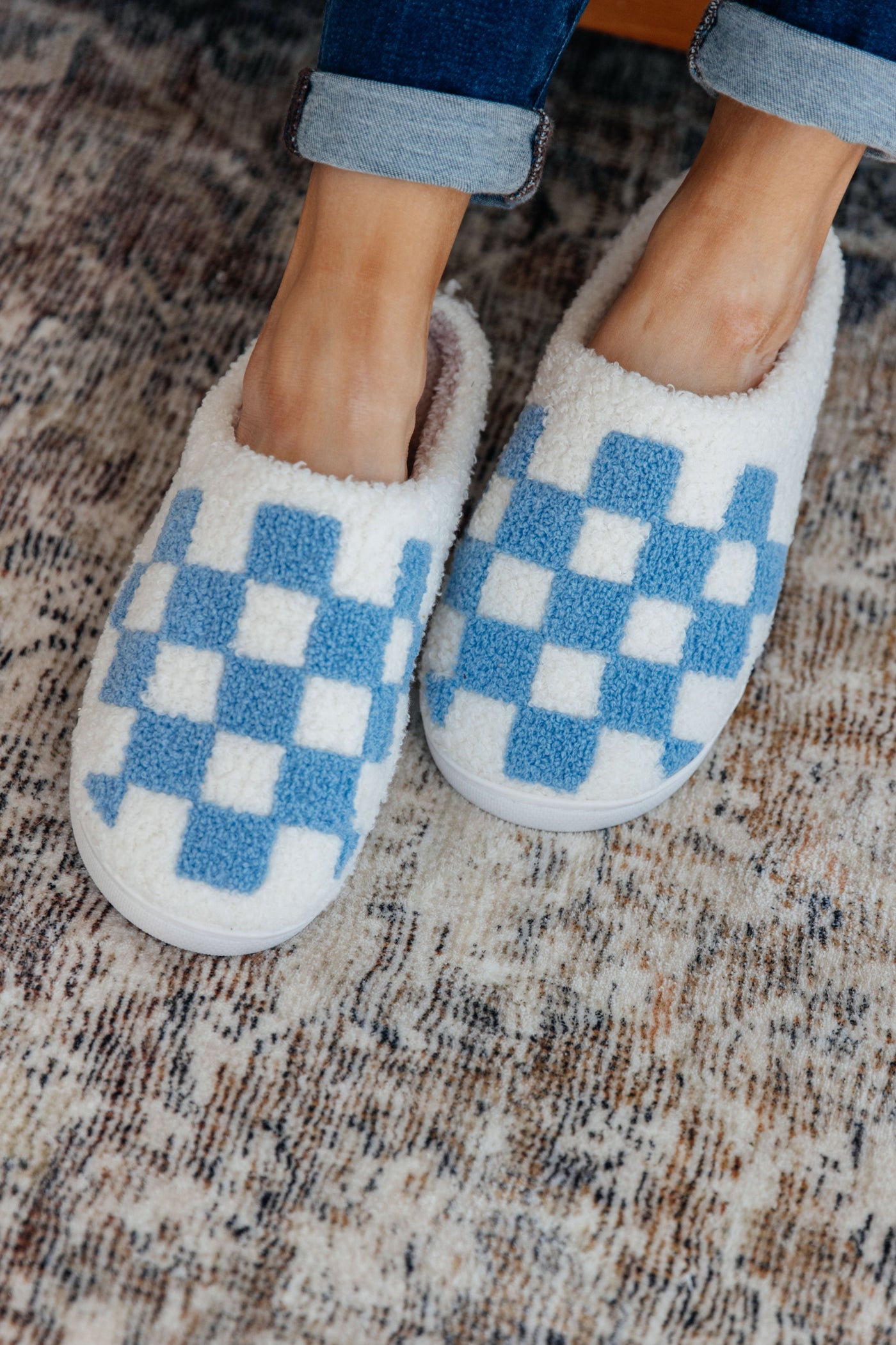 Step your way into comfort with these Checked Out Slippers