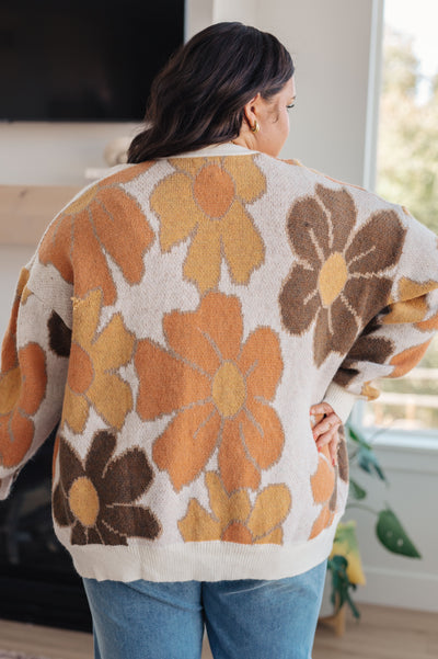 Envelop yourself in warm and cozy comfort with this Exquisitely Mod Floral Cardigan. This retro mod floral grandpa cardigan features an eye-catching large scale pattern and a soft sweater knit. Perfect for those days when you need a little extra warmth and style.