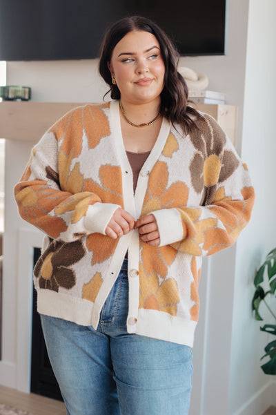 Envelop yourself in warm and cozy comfort with this Exquisitely Mod Floral Cardigan. This retro mod floral grandpa cardigan features an eye-catching large scale pattern and a soft sweater knit. Perfect for those days when you need a little extra warmth and style.
