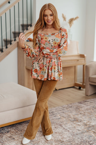 Look effortlessly stylish in our Fall For Florals Babydoll Top. This sweet, feminine style features a mixed-print floral pattern, buttery-soft fabric and balloon sleeves for a comfortable and flattering look