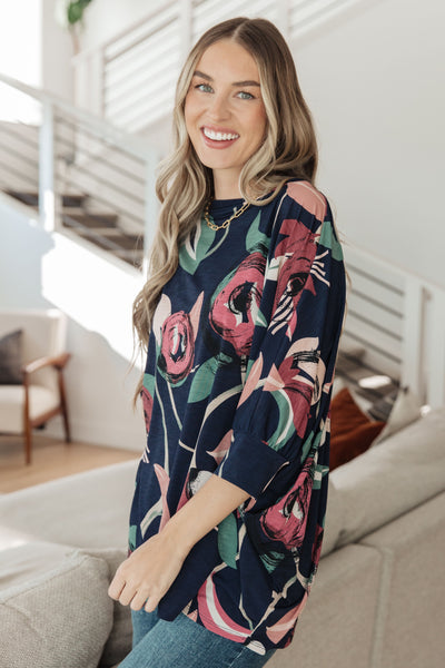 The Float On Floral Top is the perfect addition to your wardrobe. The boxy fit and cuffed dolman sleeves make it both comfortable and flattering, and the statement large scale floral print adds a touch of personality.