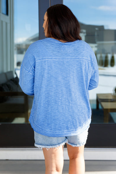 Effortlessly layer up with our Gently Down the Stream Long Sleeve Top! Made from lightweight jersey knit, it features a boat neckline, drop shoulder, and high-low raw hem