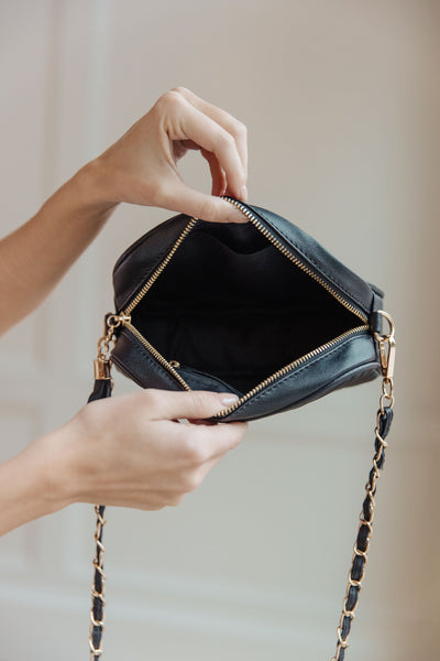 Make your style statement with the Get What You Need Crossbody. Crafted with quilted vegan leather and gold accents, it features a gold chain strap and tassel zipper for easy access