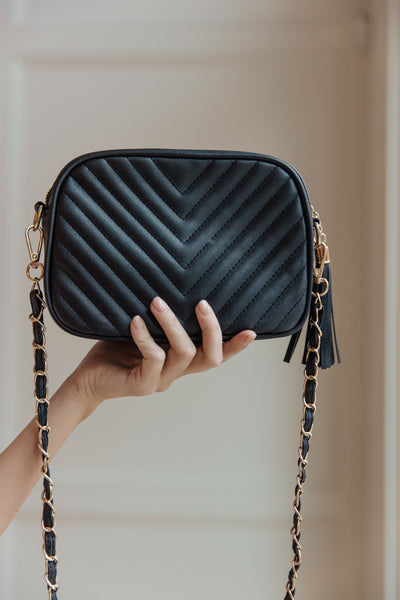 Make your style statement with the Get What You Need Crossbody. Crafted with quilted vegan leather and gold accents, it features a gold chain strap and tassel zipper for easy access