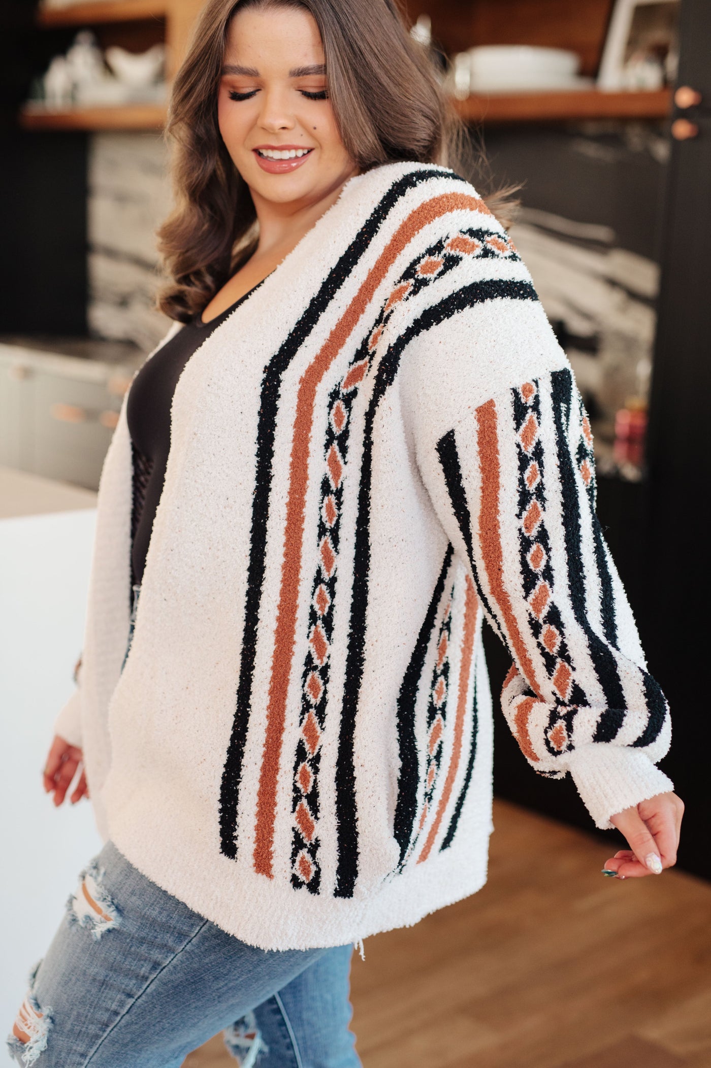 This cardigan is sure to become your new go-to. The Holding On Aztec Print Cardigan features a super soft sweater knit that provides warmth and comfort