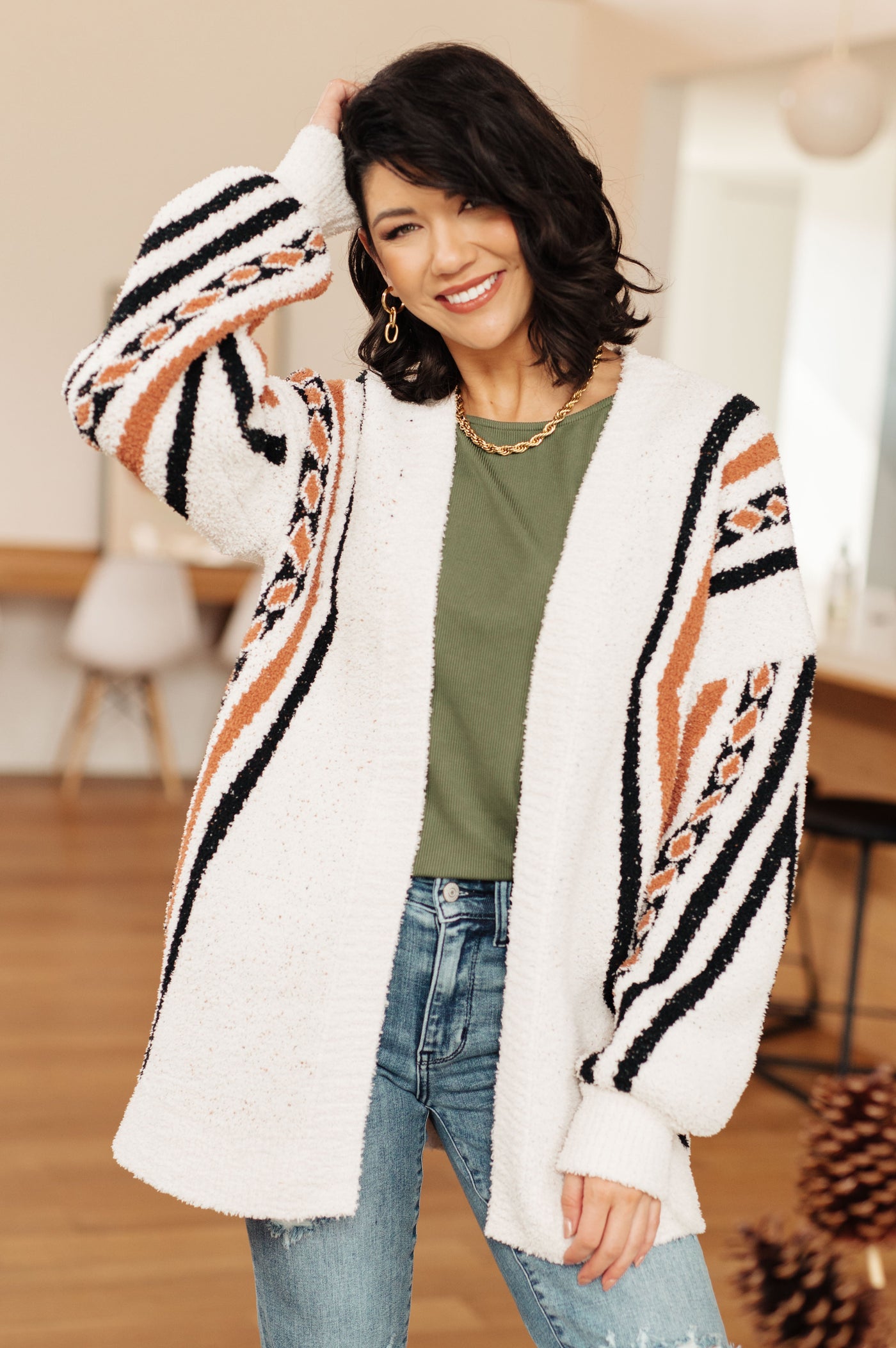 This cardigan is sure to become your new go-to. The Holding On Aztec Print Cardigan features a super soft sweater knit that provides warmth and comfort