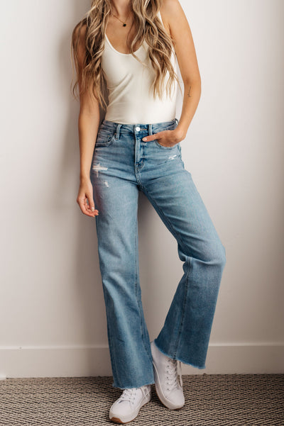 These jeans feature a high rise, zip fly and wide leg for an effortlessly stylish look, and the rigid denim and raw hem provide a timeless feel you will love.These jeans feature a high rise, zip fly and wide leg for an effortlessly stylish look, and the rigid denim and raw hem provide a timeless feel you will love.