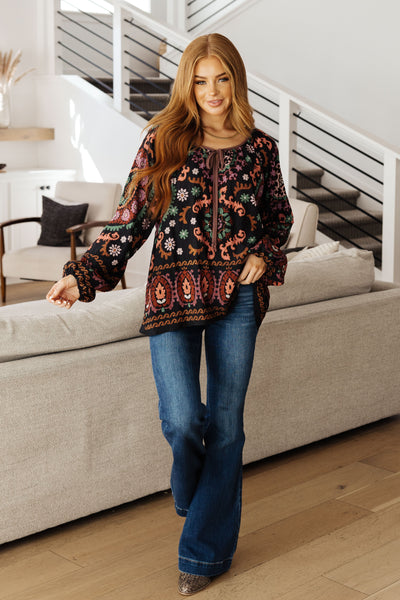 Be daring and vibrant with this I Feel That Peasant Blouse. This gorgeous blouse is beautifully textured with a woven fabric, features a tie-neck keyhole, and is accented with a vibrant boho border print in rich colors