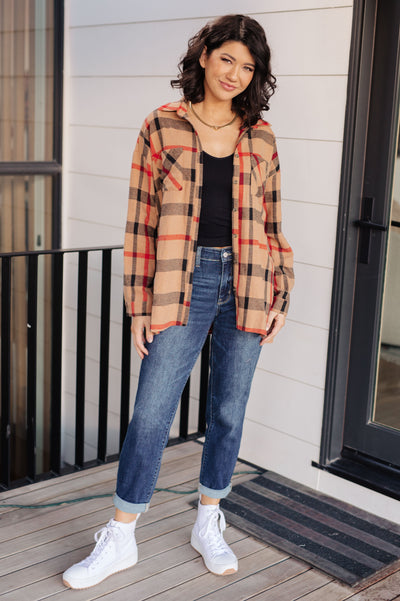 Made from lightweight flannel, this collared shirt features a large scale plaid design and side slits for a flattering fit.