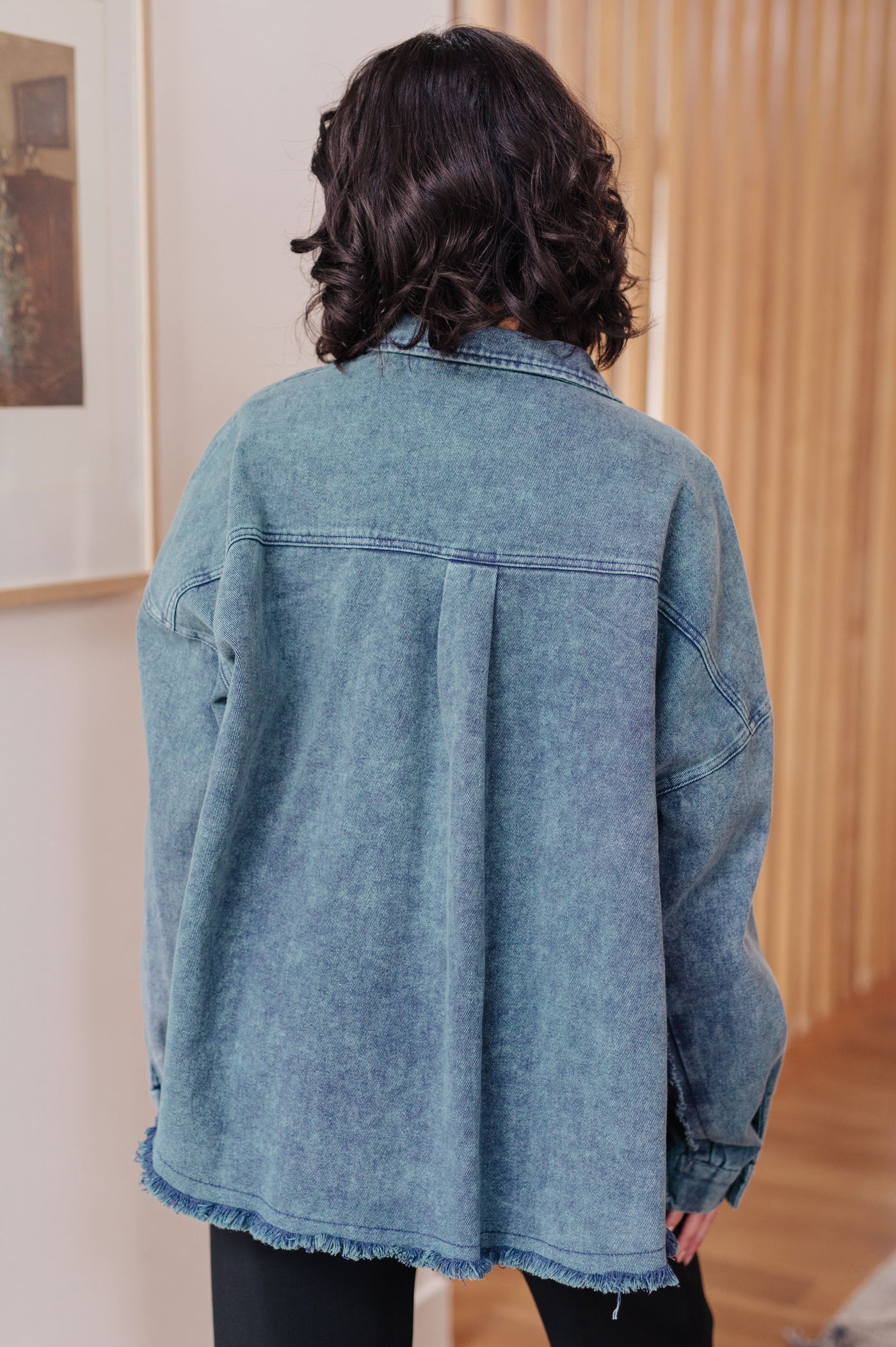 Introducing the Just In Case Mineral Wash Shacket! Made with mineral wash denim twill, this shacket features a raw hem, front pocket, and button front.