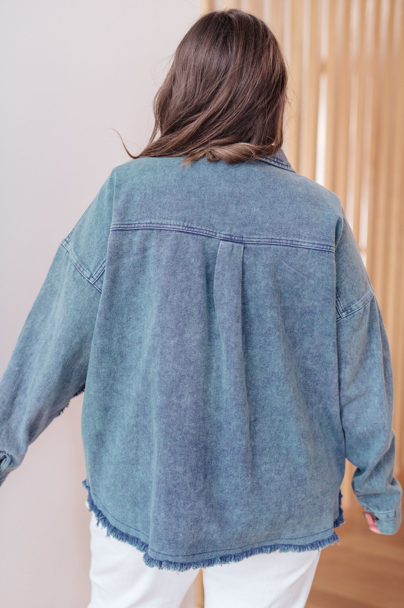 Introducing the Just In Case Mineral Wash Shacket! Made with mineral wash denim twill, this shacket features a raw hem, front pocket, and button front.