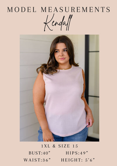 Made with lush Poly Satin, this blouse features a collared neckline, half front button closures, and a playful bat wing design. Complete with a patch pocket, banded sleeve cuffs, and a high-low scooped hem.