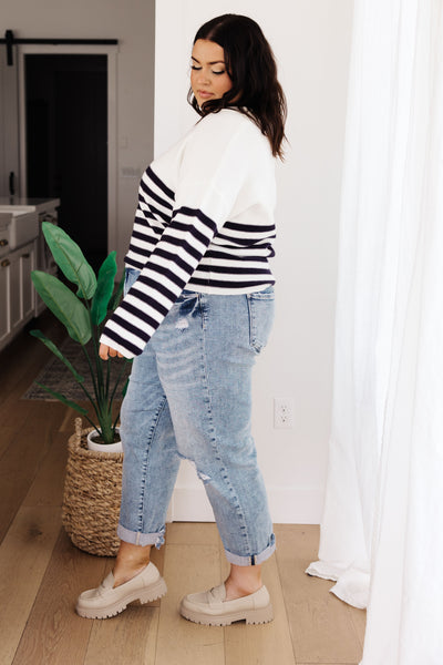 Wrap yourself up in cozy style with the Memorable Moment Striped Sweater! Featuring a modern collared V-neckline and stripes along the lower half, this soft sweater knit offers a relaxed fit that makes it the perfect updated classic