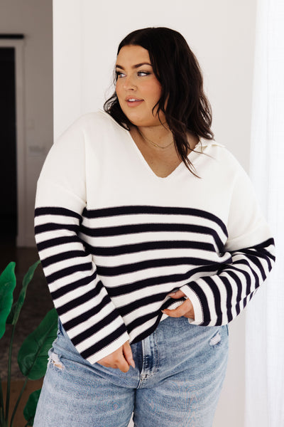 Wrap yourself up in cozy style with the Memorable Moment Striped Sweater! Featuring a modern collared V-neckline and stripes along the lower half, this soft sweater knit offers a relaxed fit that makes it the perfect updated classic
