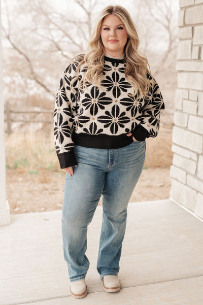 This Mid Mod Floral Sweater is as cozy as it is chic! Crafted from a sweater knit with contrasting trim, this piece will keep you snug and stylish all winter long.
