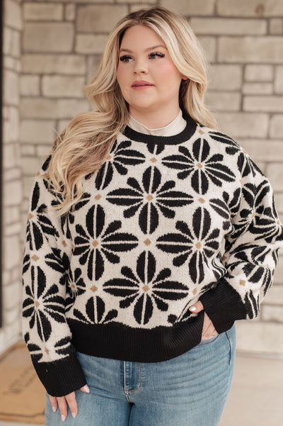 This Mid Mod Floral Sweater is as cozy as it is chic! Crafted from a sweater knit with contrasting trim, this piece will keep you snug and stylish all winter long.