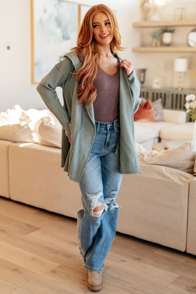 Made with cozy French Terry fabric, this cardigan features a unique reverse fabric detail and front pockets for added convenience