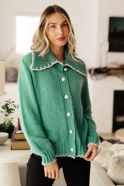 This relaxed, cozy Ready for Surprise Cardigan features a soft sweater knit, exaggerated shawl collar, contrast trim, and covered buttons