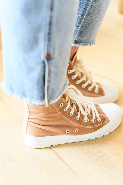 Feel unstoppable in our Run Me Down Velvet High Tops! Crafted with a luxuriously soft velvet upper and a chunky white sole, these tan kicks are the ultimate blend of style and comfort