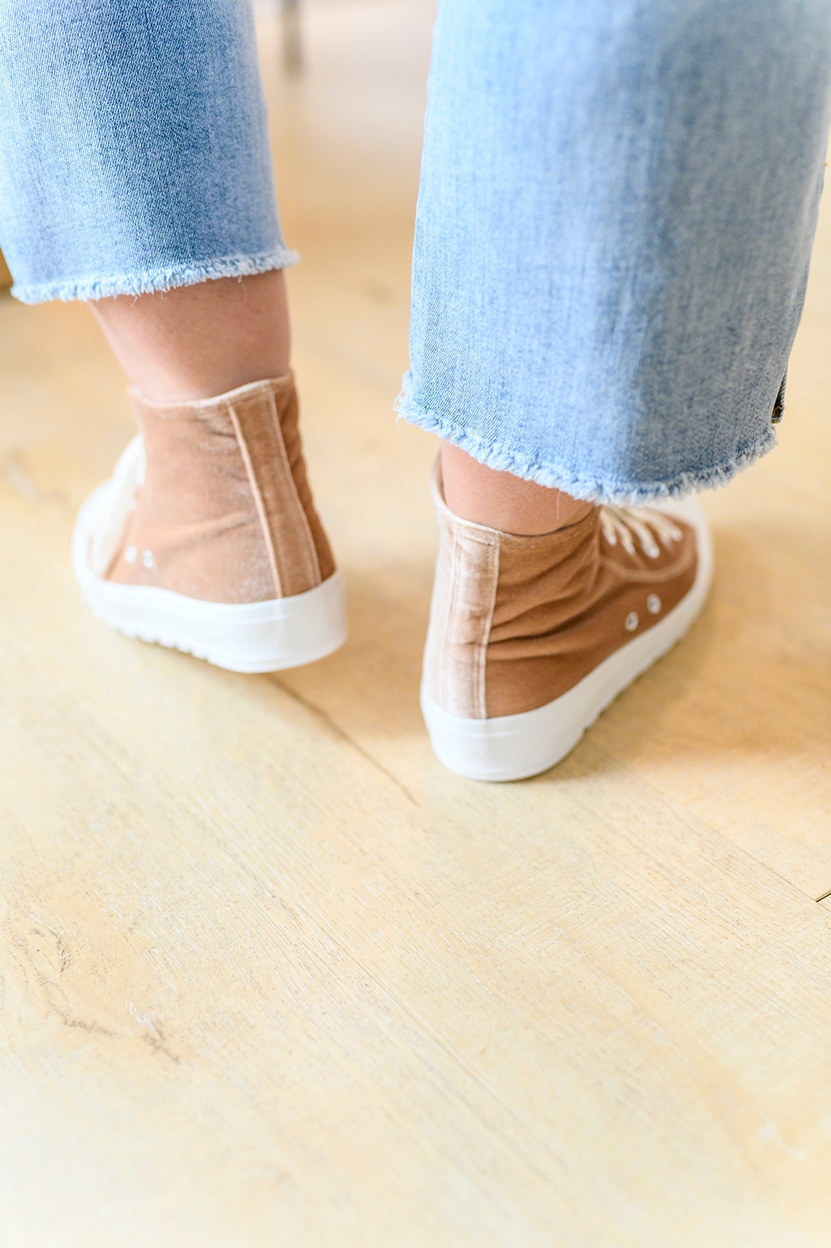 Feel unstoppable in our Run Me Down Velvet High Tops! Crafted with a luxuriously soft velvet upper and a chunky white sole, these tan kicks are the ultimate blend of style and comfort