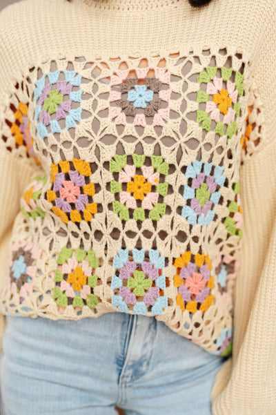 Get your groove on with the Square Dance Granny Square Sweater! Made of soft, cozy sweater knit with crochet accents