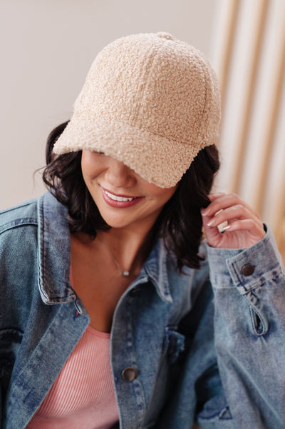 Stay warm and stylish with our Lyla Sherpa Ball Cap! Made with boucle sherpa fleece, it will keep you cozy on chilly days