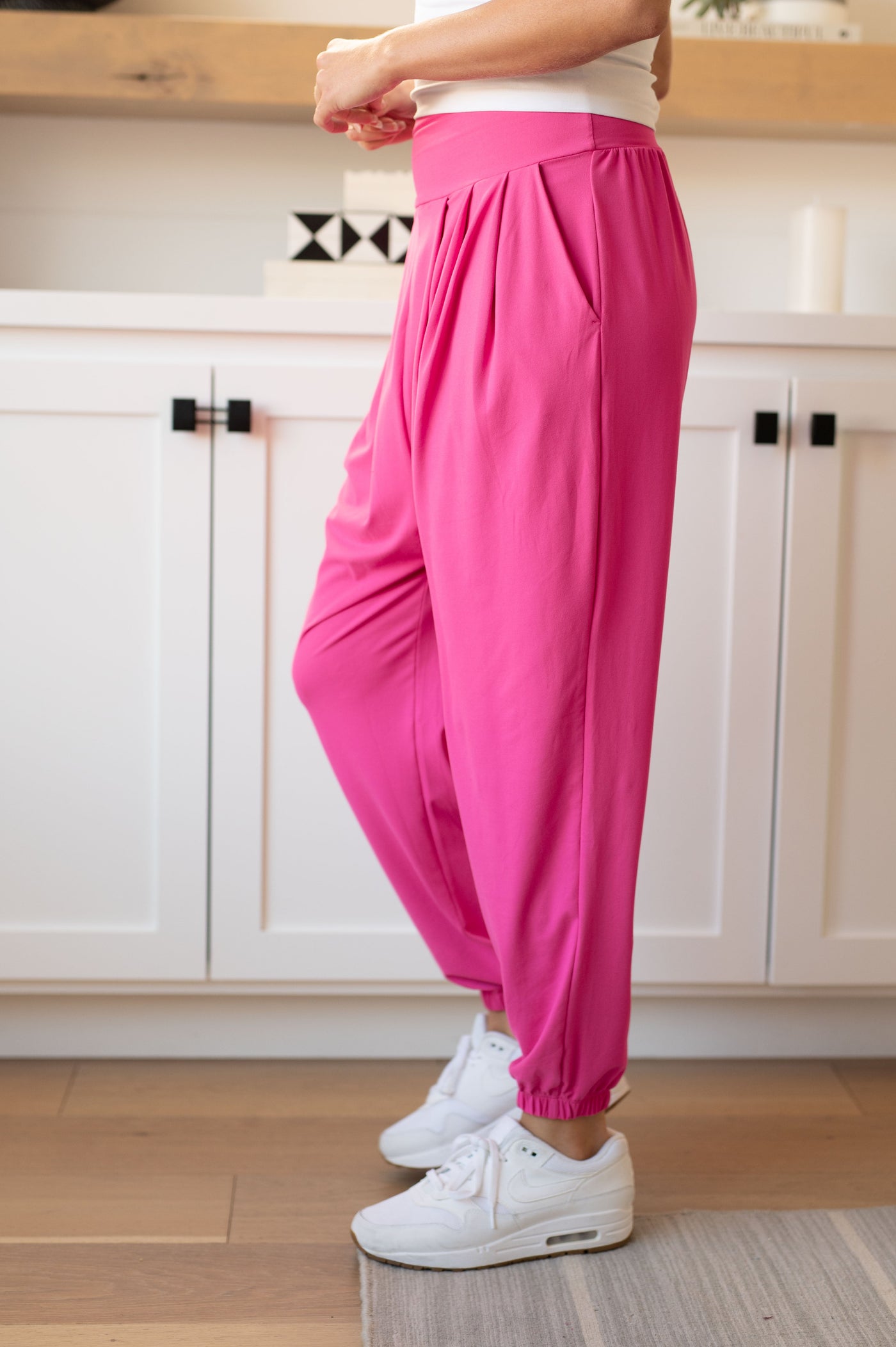 Lounge in luxury with The Motive Slouch Joggers! Built for comfort with a thick banded high waistline topping a slouchy pleated design, side seam pockets, tapered pant legs, and an elasticated ankle cuff