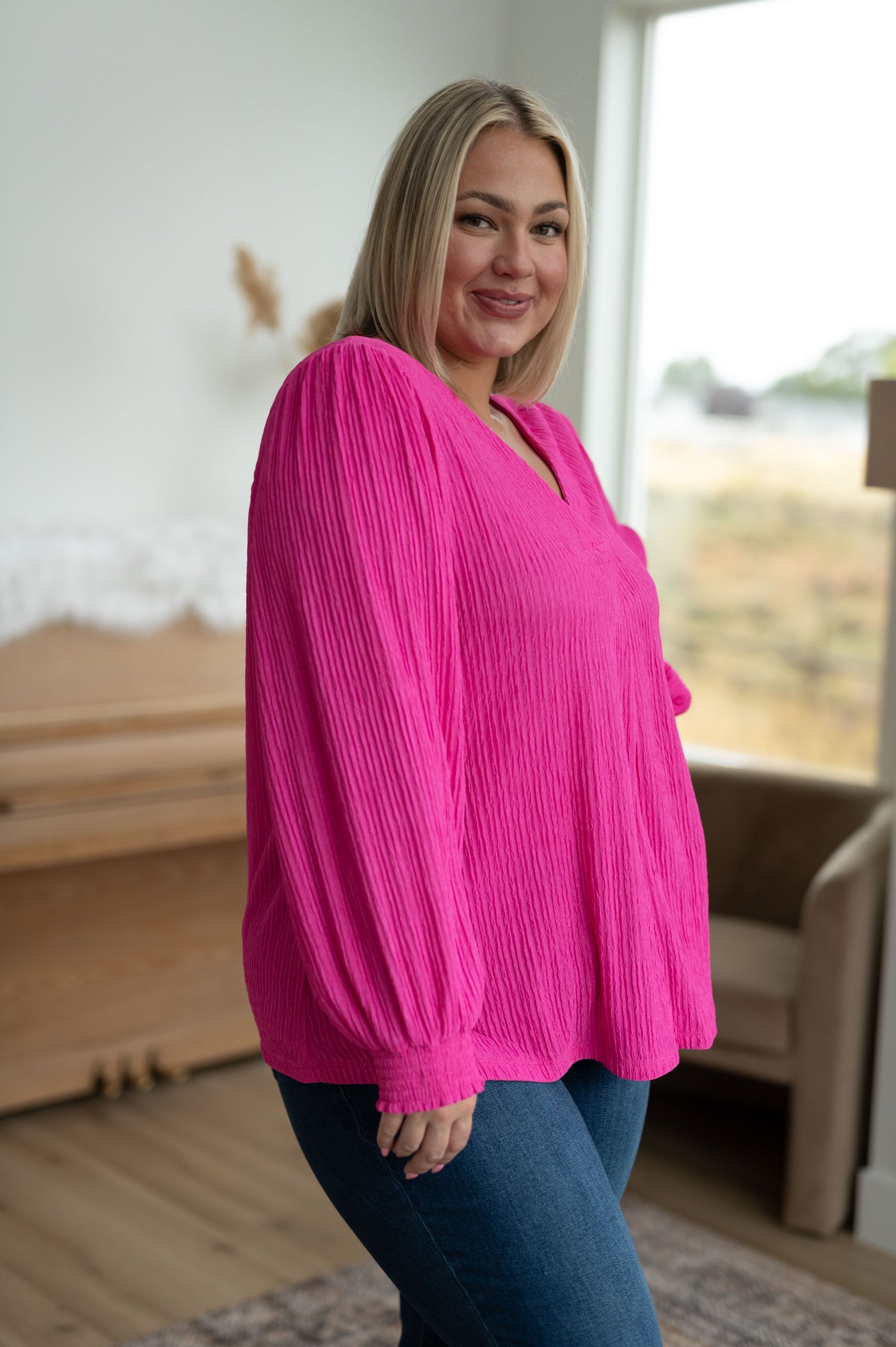 This Very Refined V-Neck Blouse is an effortless look to take you through the season. Crafted from textured fabric, it features a pleated v-neckline, balloon sleeves and smocked elastic cuffs for an easy, comfortable fit.