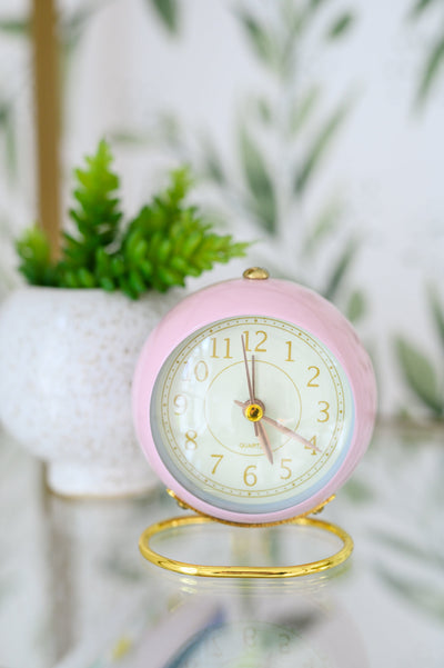 Add a touch of whimsy to your workspace with the Wonderland Desk Clock